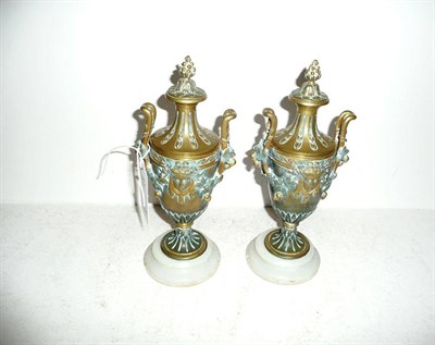 Lot 247 - Pair of bronze urns with lids and marble bases