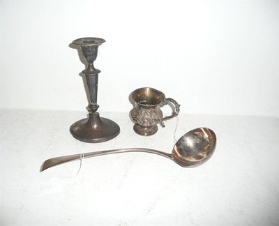 Lot 343 - Silver candlestick, silver ladle and a silver mug