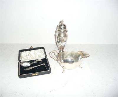 Lot 344 - Silver castor, silver sauce boat and a silver christening set