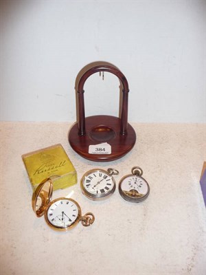 Lot 384 - Gold plated full hunter, and two other pocket watches, and a stand