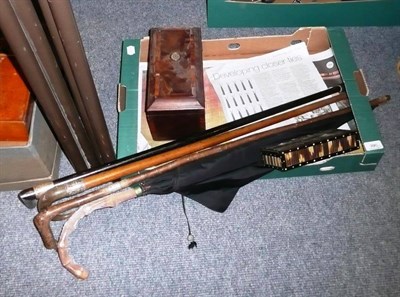 Lot 390 - A Georgian mahogany tea caddy, top hat and gloves, three walking sticks with silver mounts and...