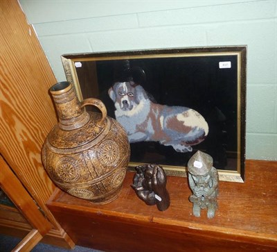 Lot 417 - A gilt-framed woolwork picture of a dog, two ornaments and a large jug marked Jasba