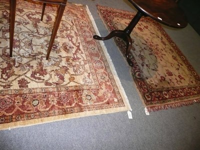 Lot 514 - A Persian rug (modern, a.f.) together with a machine made rug .