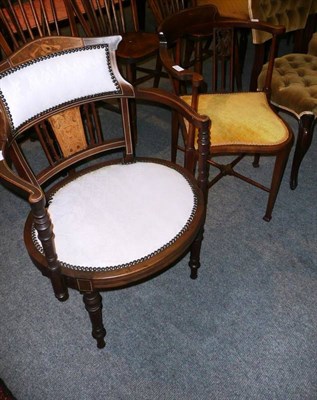 Lot 534 - Two Edwardian inlaid mahogany elbow chairs