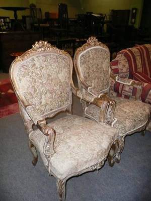 Lot 549 - A pair of 19th century carved giltwood framed upholstered open armchairs