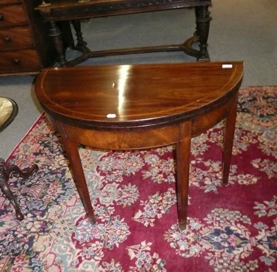 Lot 552 - 19th century mahogany fold over tea table