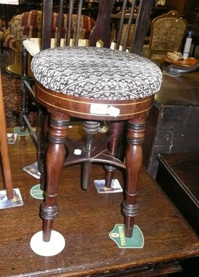 Lot 567 - A 19th century mahogany piano stool