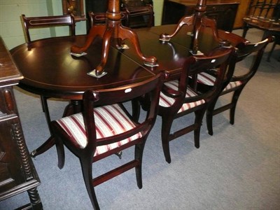 Lot 586 - Regency style mahogany twin pedestal table and six chairs