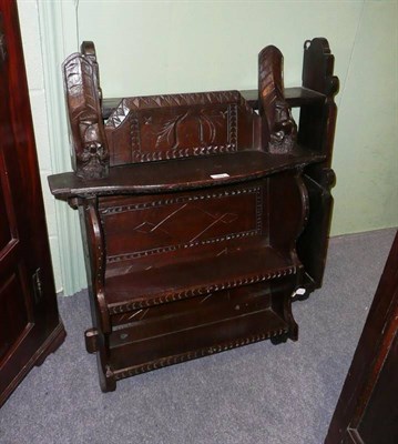 Lot 592 - A set of carved oak hanging shelves and two further sets of hanging shelves