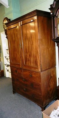 Lot 621 - George III mahogany linen press