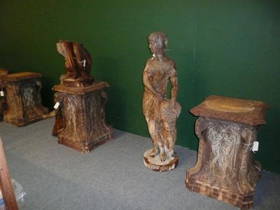 Lot 706 - A set of four cast metal figures on stands