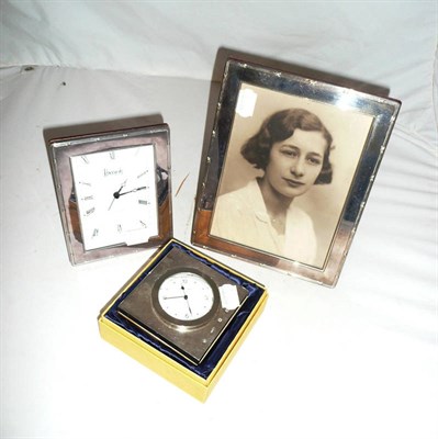Lot 18 - Two silver mounted quartz clocks and a silver mounted photo frame