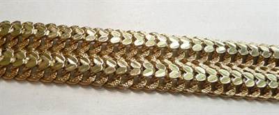 Lot 78 - A pierced bracelet with clasp stamped "375", 28g