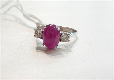 Lot 91 - A 14ct white gold ruby and diamond set three stone ring