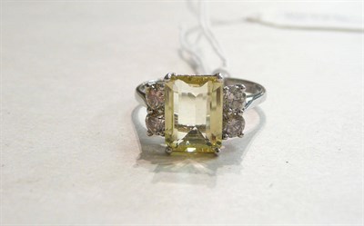 Lot 94 - A 14ct white gold, yellow beryl and diamond ring