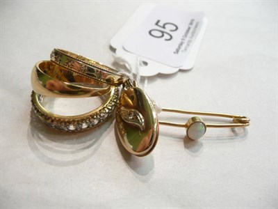 Lot 95 - A diamond set eternity ring, an 18ct gold ring, a 9ct gold ring, an opal set brooch and a 9ct...