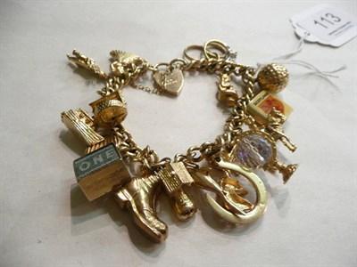 Lot 113 - A 9ct gold charm bracelet (not all charms gold)