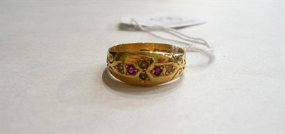 Lot 115 - A 22ct gold ruby and seed pearl ring