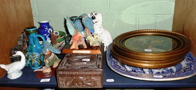 Lot 121 - A shelf of decorative ceramics and ornamental items including a Burmese dragon carved hardwood box
