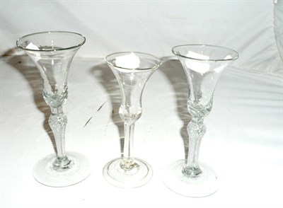 Lot 143 - Two 18th century spiral-twist stem wine glasses and another