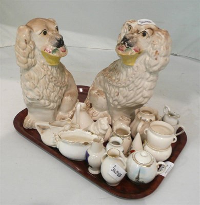 Lot 172 - Two Staffordshire dogs with baskets and a quantity of Goss and other crested ware