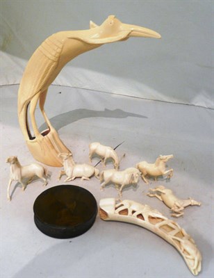 Lot 187 - Bone carving of a bird with snake and eight others
