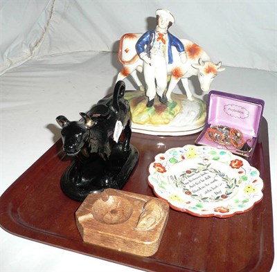 Lot 190 - Staffordshire figure, cow creamer, small quantity of jewellery, a nursery plate and a Mouseman...