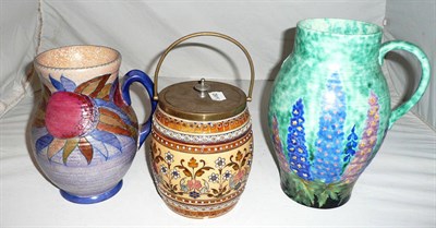 Lot 194 - A Crown Ducal Charlotte Rhead jug, a Crown Devon Hollyhocks jug and a Mettlach stoneware...