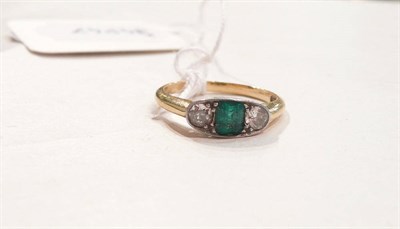 Lot 270 - An emerald and diamond three stone ring