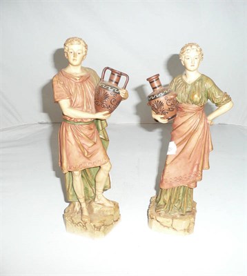 Lot 299 - A pair of Royal Dux figures of Greek water carriers (2)