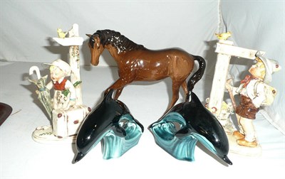 Lot 324 - Beswick bay horse, two Hummel figural groups and two Poole Pottery dolphins