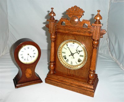 Lot 351 - An Ansonia oak cased mantel clock and an Edwardian balloon cased clock (2)