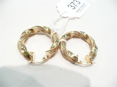 Lot 373 - Pair of gold Creole earrings