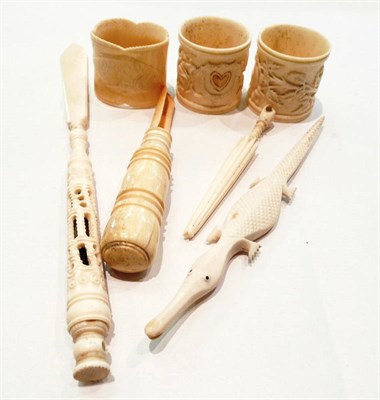 Lot 388 - Bone apple corer, three napkin rings and three other items