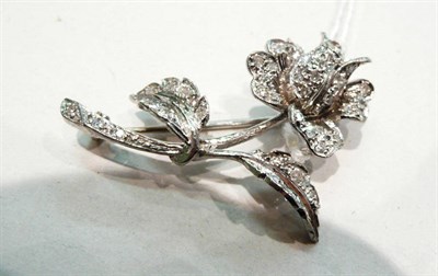 Lot 403 - 18ct white gold diamond set flower brooch