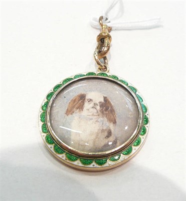 Lot 407 - An enamelled picture locket