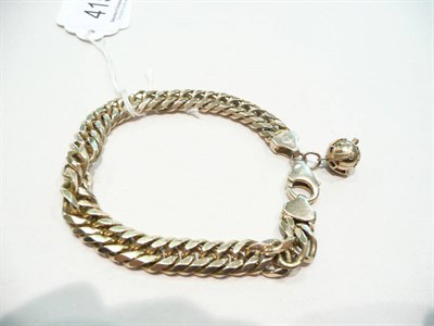 Lot 415 - A 9ct gold curb bracelet with Masonic charm