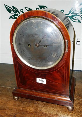 Lot 445 - A mahogany inlaid striking mantel clock and pendulum