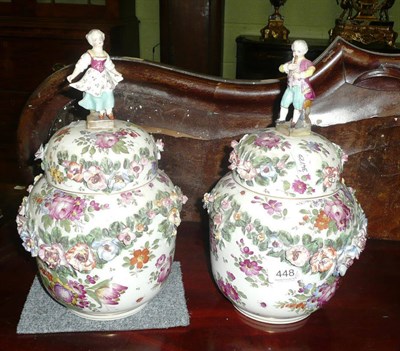 Lot 448 - Pair of Continental floral-encrusted and painted vases and covers with figural knops