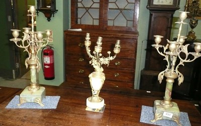 Lot 450 - A pair of onyx and gilt metal candelabra and another (3)