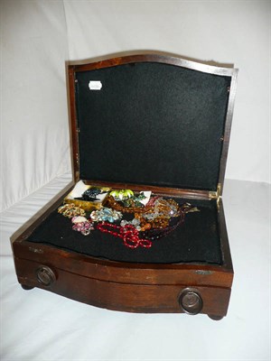 Lot 476 - Two Trifari brooches, glass beads and assorted costume jewellery and an oak canteen box