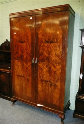 Lot 581 - A walnut double wardrobe