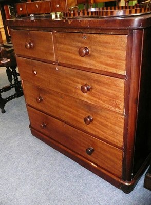 Lot 592 - A 19th century mahogany chest of two short over three long graduated drawers on platform base,...