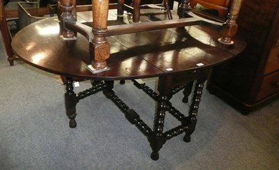 Lot 594 - Oak gateleg dining table