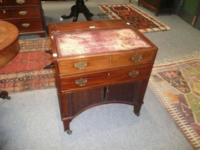 Lot 626 - A George III mahogany writing table, the broad rectangular top with foldout base, red leather...