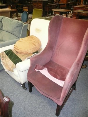 Lot 645 - A pink upholstered wing armchair and a cream upholstered slipper-back chair