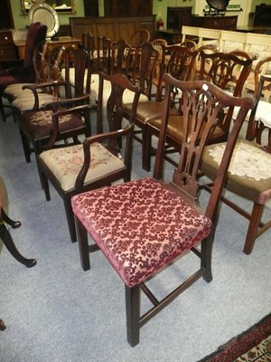 Lot 658 - Two Georgian mahogany elbow chairs in Chippendale style and a similar single chair