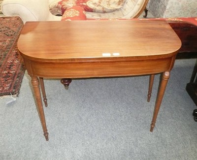 Lot 670 - 19th century mahogany D-shaped fold-over card table