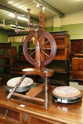 Lot 678 - A fruitwood spinning wheel and two Victorian footstools