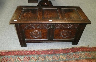 Lot 693 - Carved oak coffer with two panel front